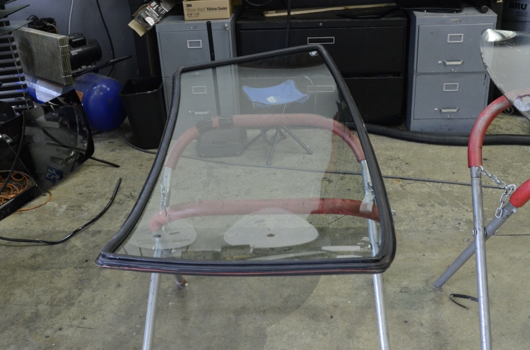 New windshield, seal is applied without urethane, then bead of urethane around the outside edge. Inside of seal isn't glued until the glass is centered.