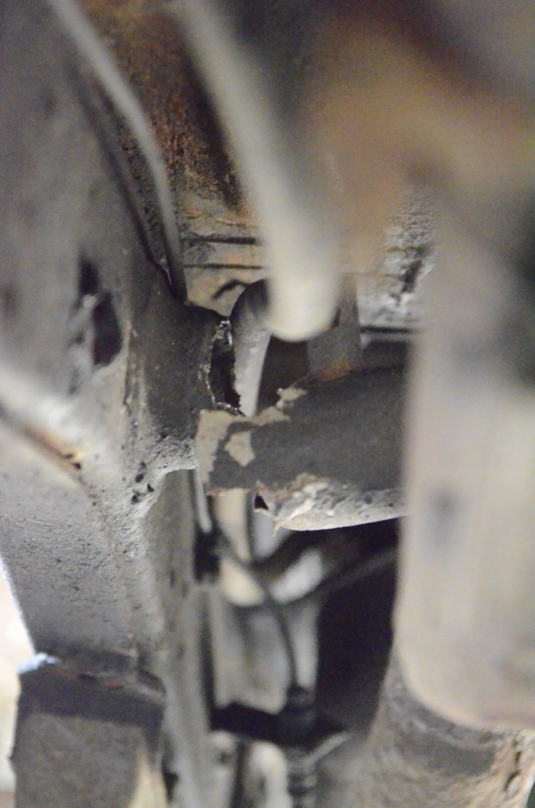 Can see the passenger side rear brake line passes very close to the shock tube. Could have been torn.